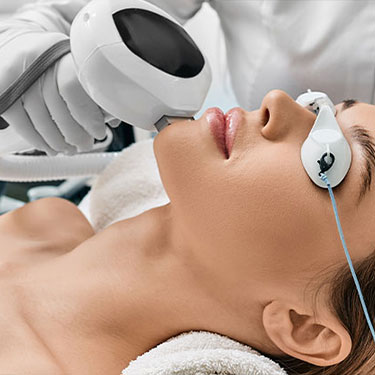 Patient receiving lumecca for enlarged pores and enlarged oil glands at Skinlastiq Medical Laser Cosmetic Spa in Burlingame